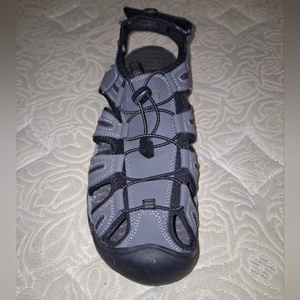 A pair of Coleman George sandals in a men's size 13M. They're in excellent shape